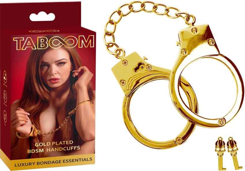Taboom | Ein Paar Handschellen aus goldfarbenem Metall.